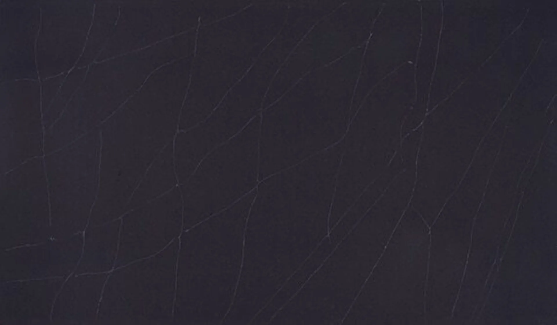 Closeup image of ONE Quartz Surfaces Broadway Black Black Quartz countertop slab