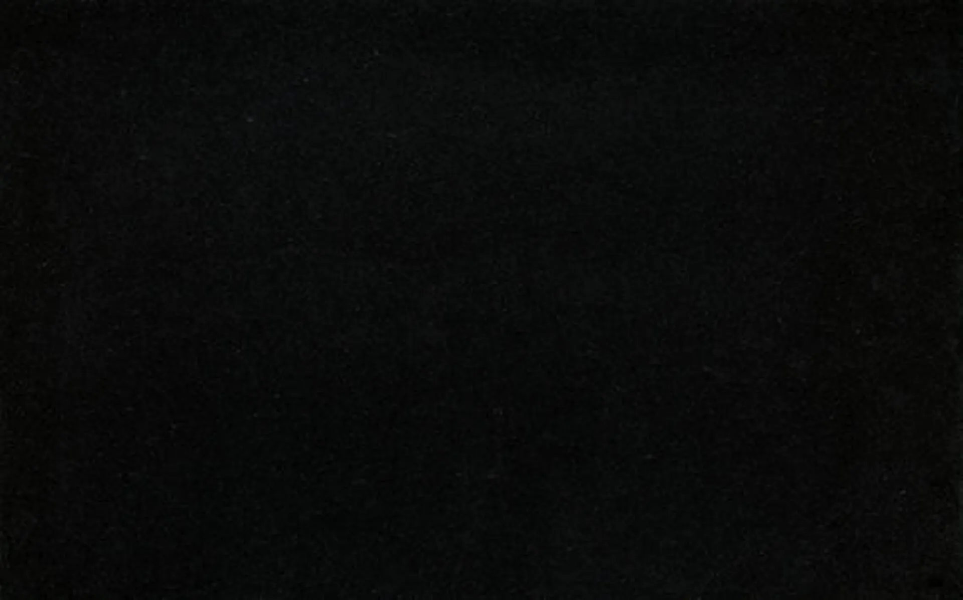 Closeup image of Black Pearl Black Granite countertop slab