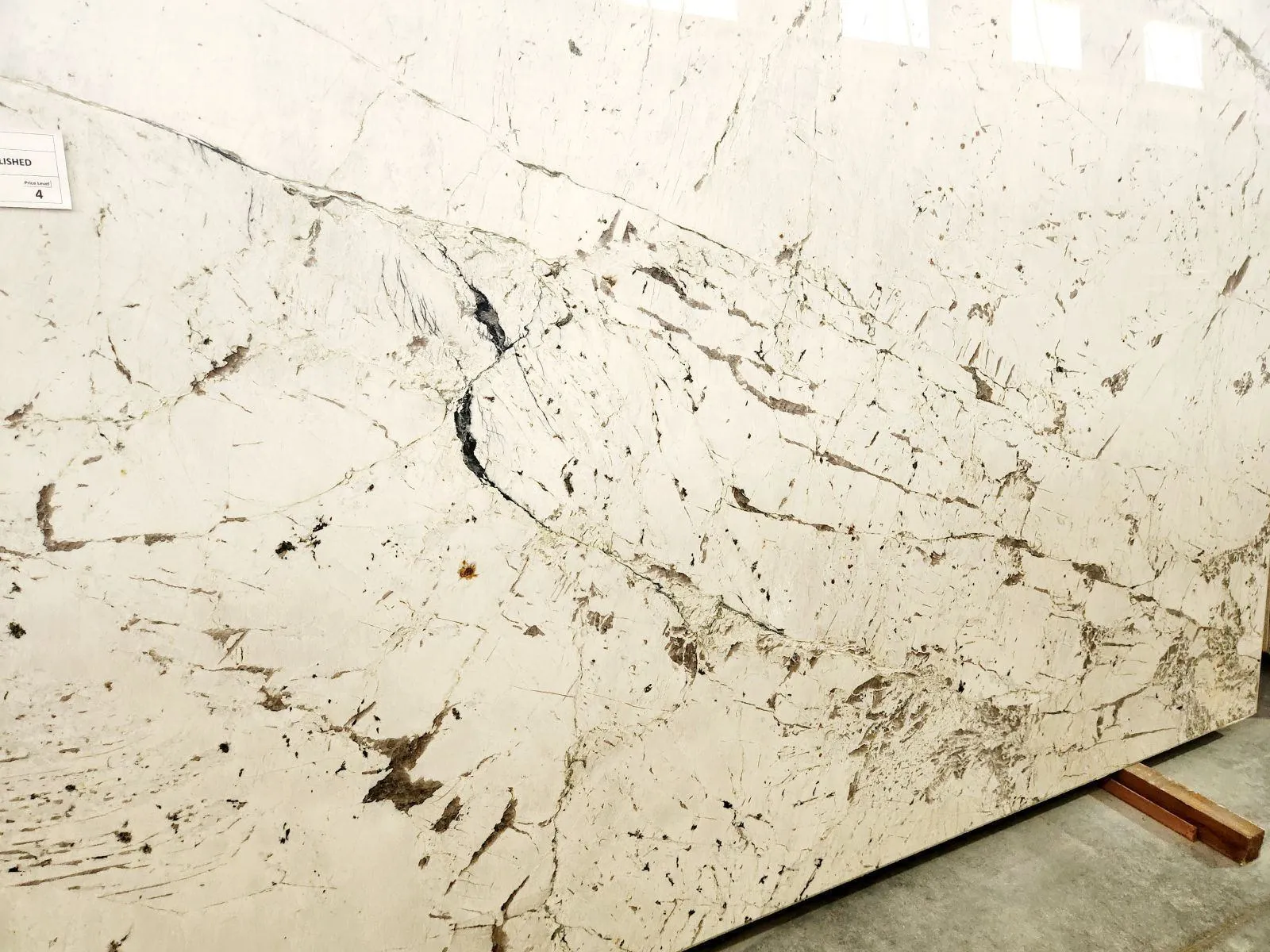 Closeup image of Lumiere White Cream Granite countertop slab