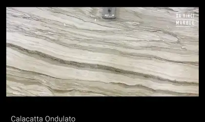 Closeup image of Calacatta Ondulato Cream Marble countertop slab