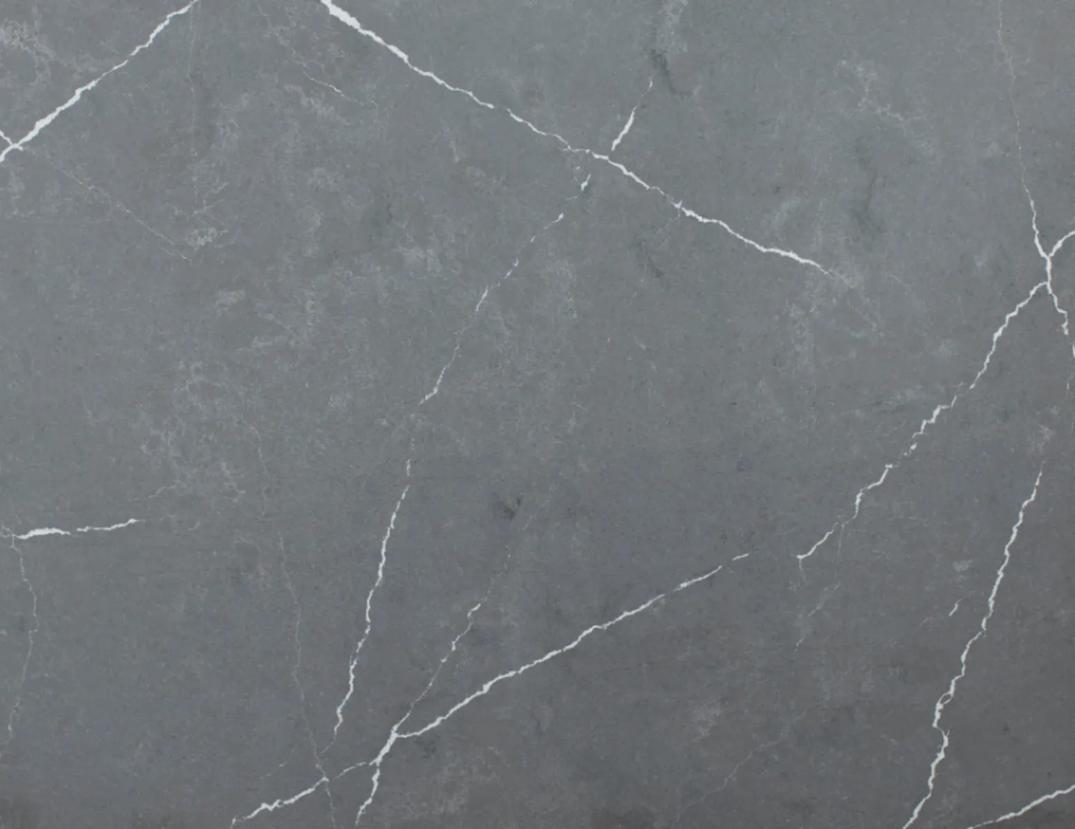 Closeup image of Marquina Grigio Grey Quartz countertop slab