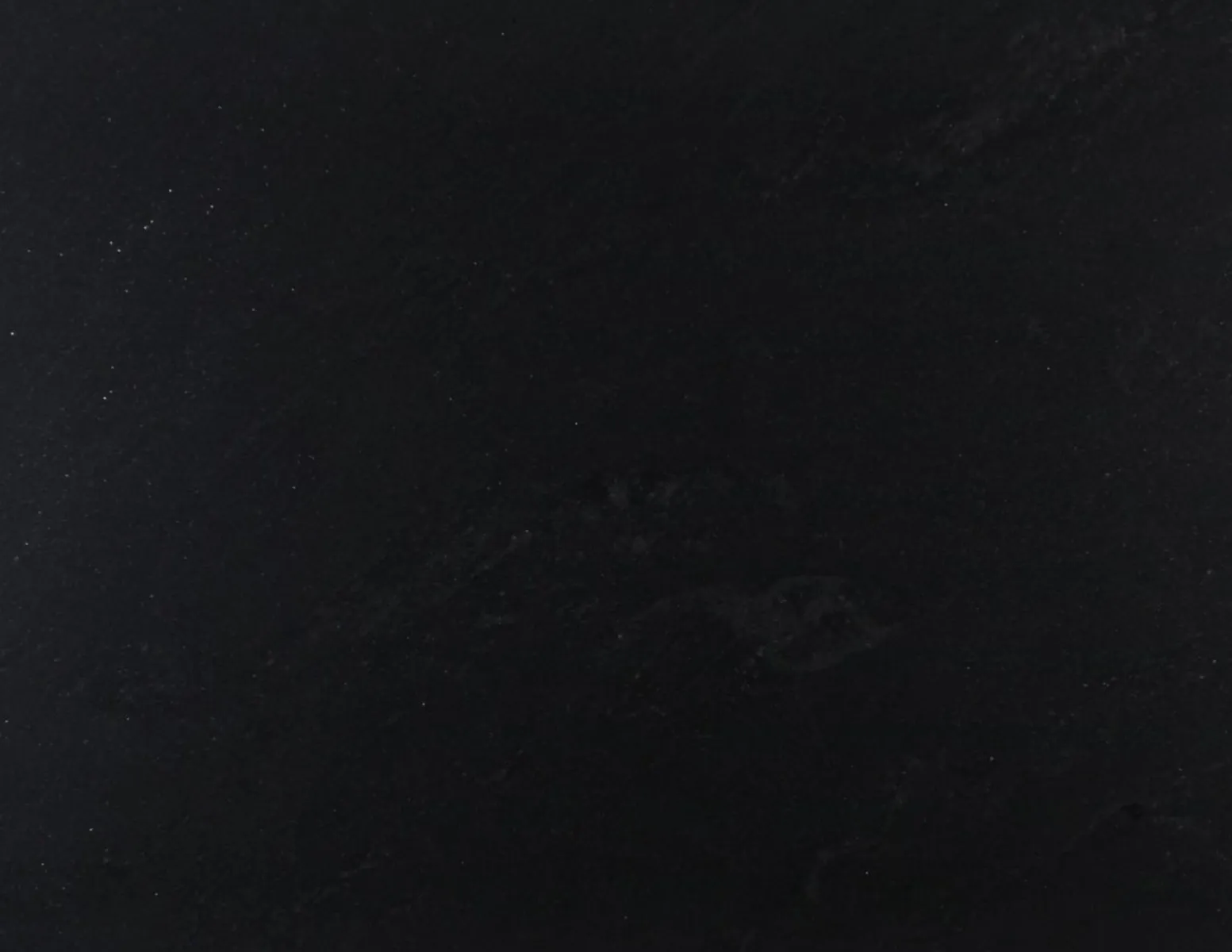 Closeup image of Mist Black Black Granite countertop slab