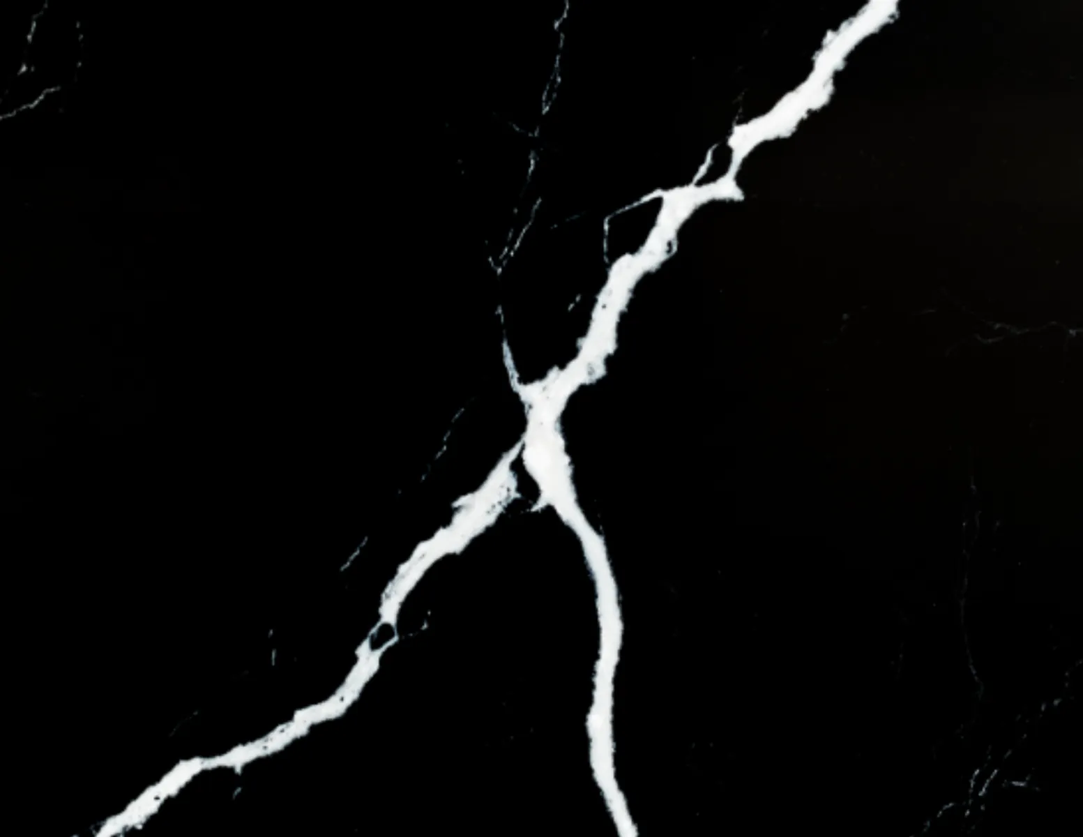 Closeup image of Vicostone Nero Marquina Black Quartz countertop slab