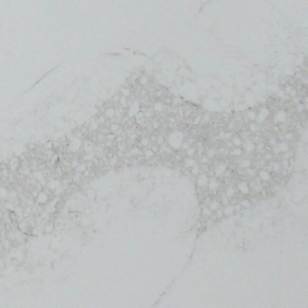 Closeup image of Aggranite Quartz Statuary Nutmeg White Quartz countertop slab