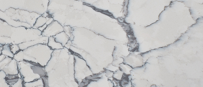 Closeup image of Q Quartz Calacatta Lago Quartz countertop slab