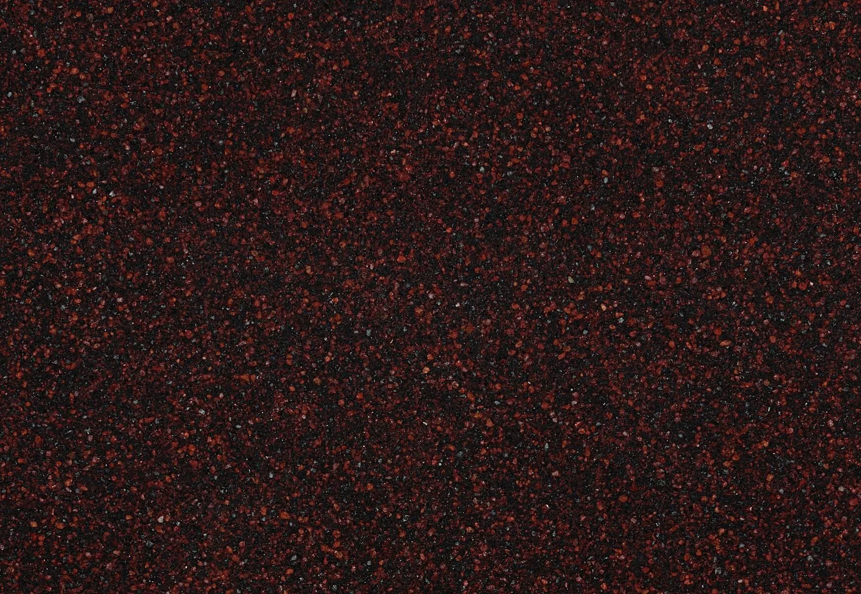 Closeup image of Cambria Wilshire Red Black Quartz countertop slab