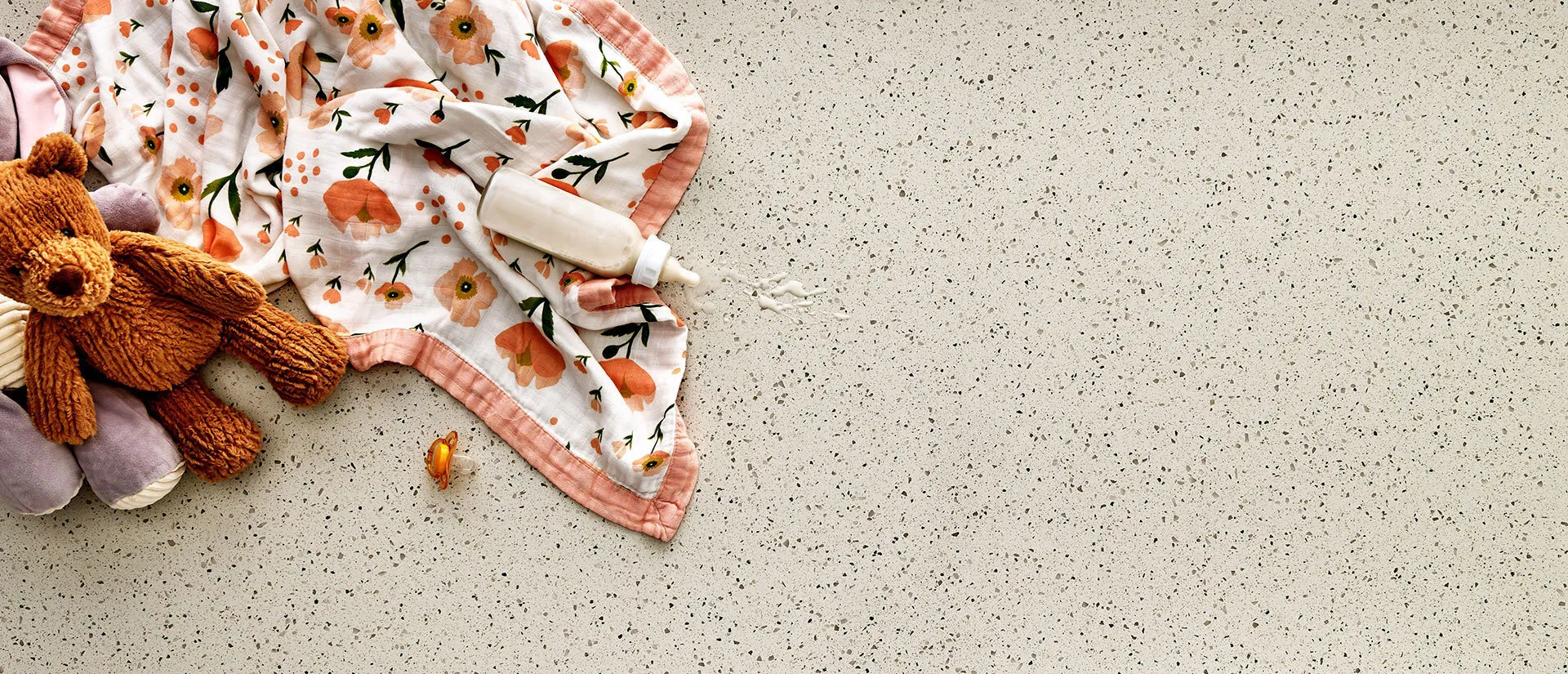 Image of installed Q Quartz Bianco Pepper Brown Quartz countertops