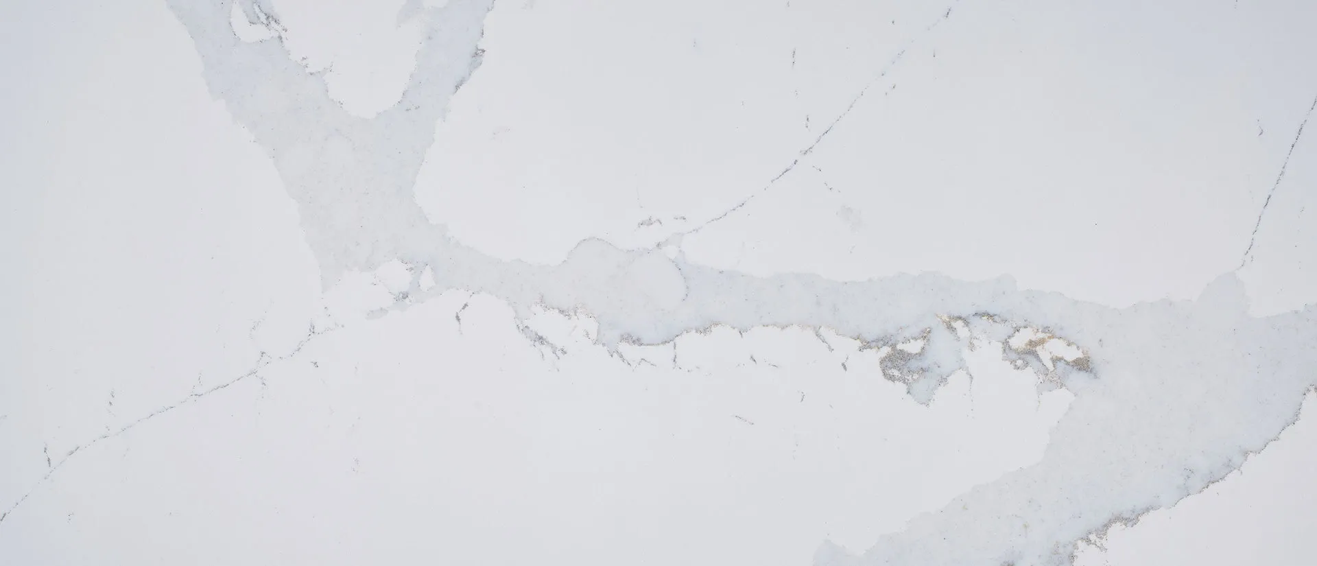 Closeup image of Q Quartz Calacatta Azai Quartz countertop slab