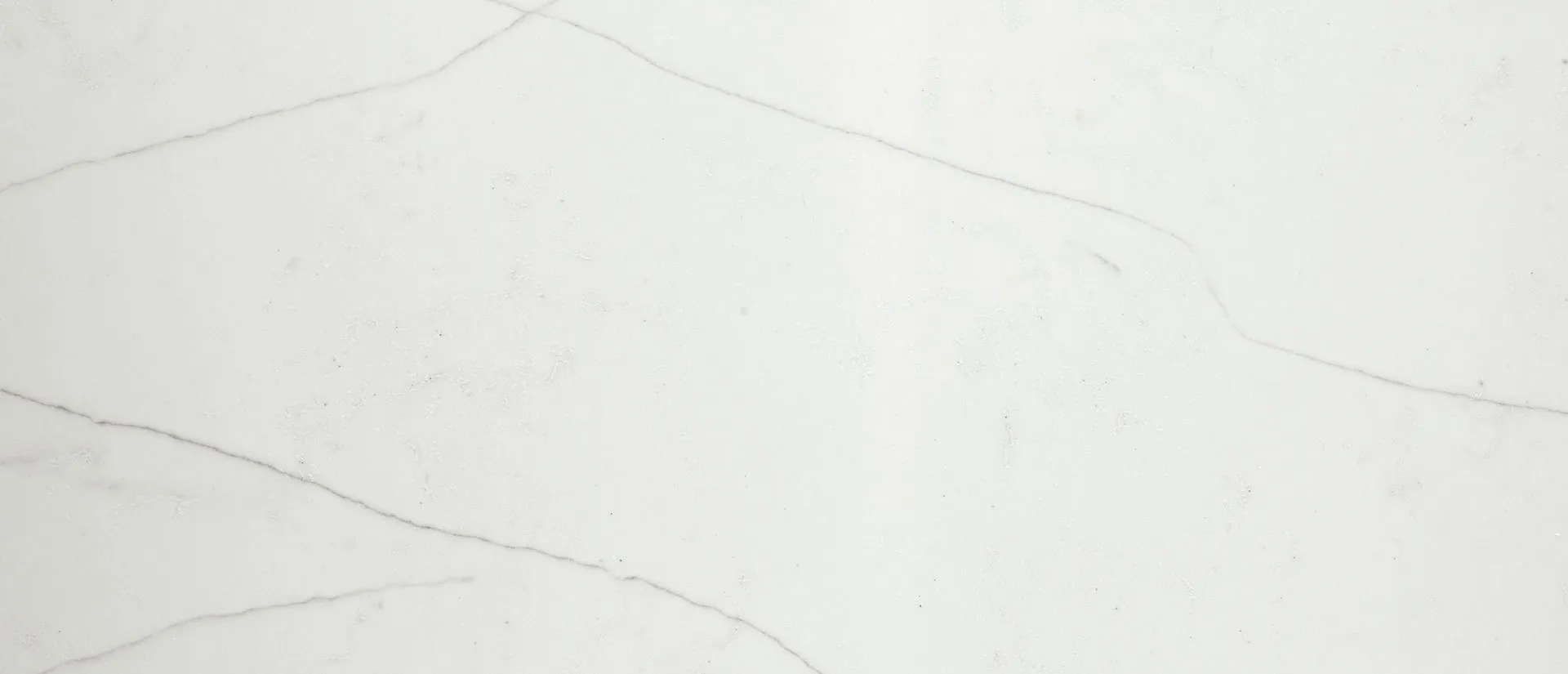 Closeup image of Q Quartz Calacatta Clara Quartz countertop slab