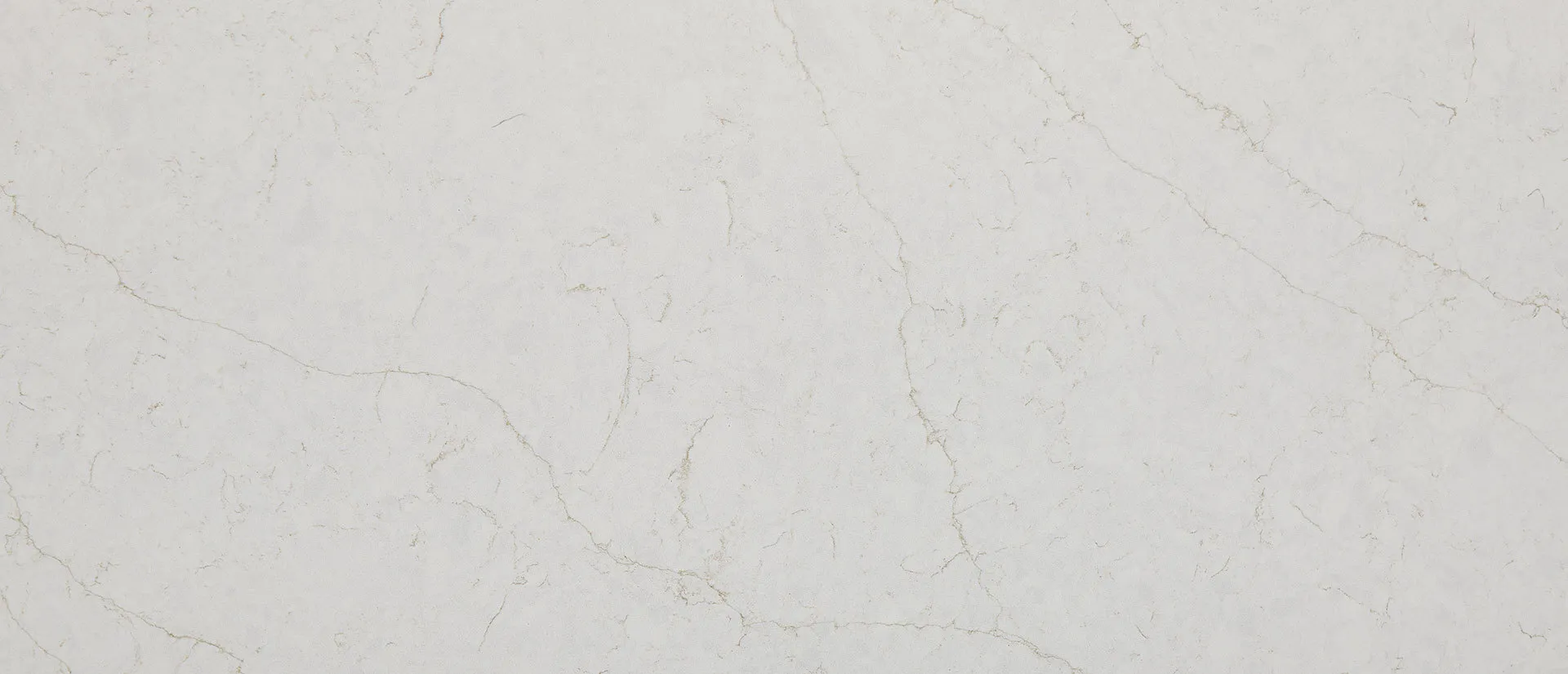 Closeup image of Q Quartz Calacatta Karmelo Quartz countertop slab