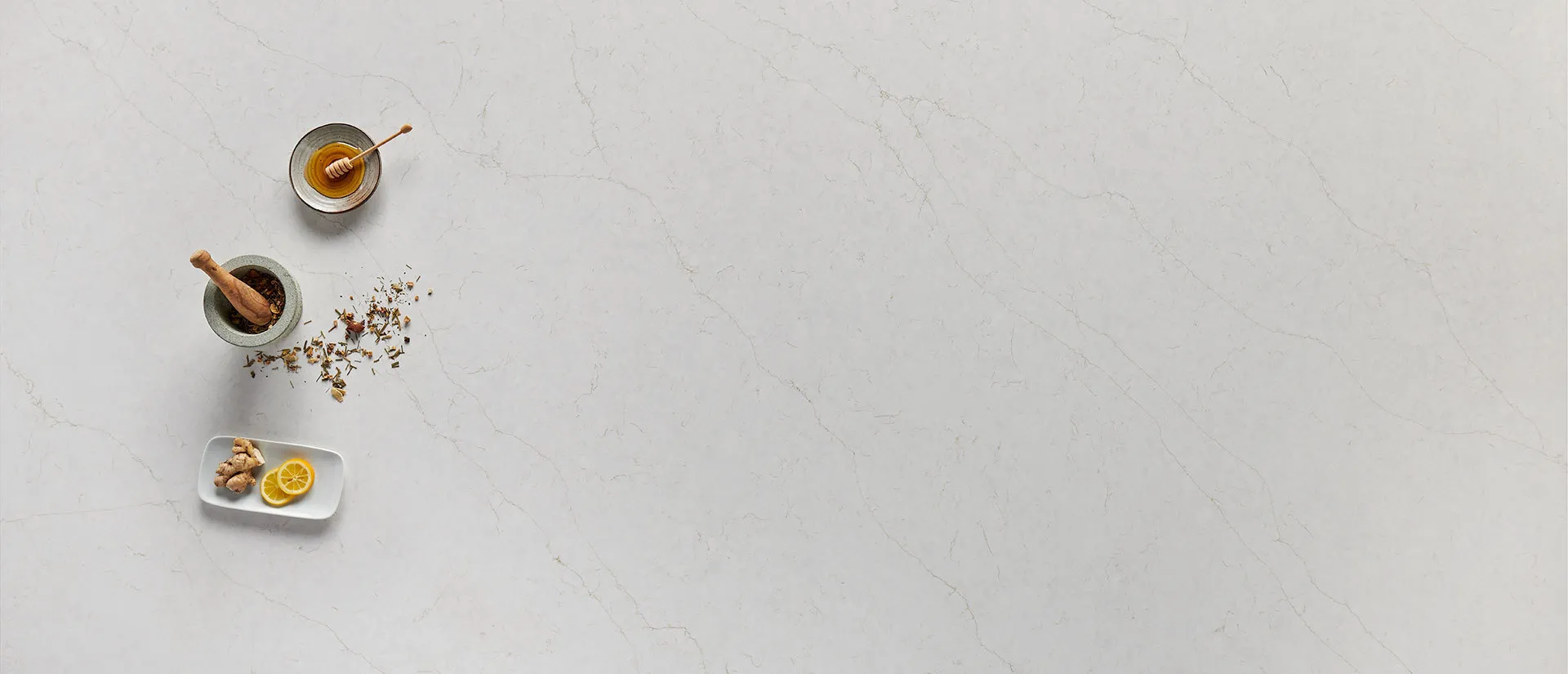 Image of installed Q Quartz Calacatta Karmelo Quartz countertops