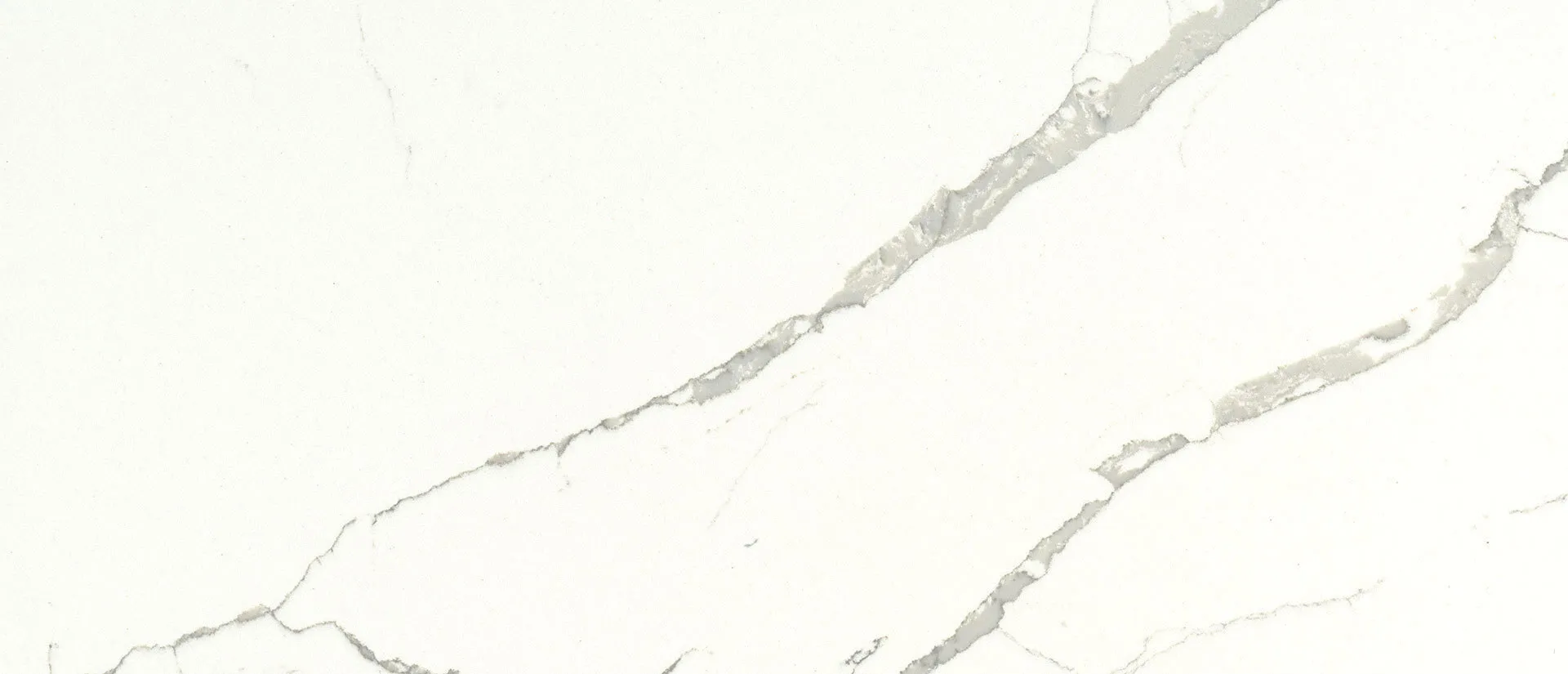Closeup image of Q Quartz Calacatta Laza Quartz countertop slab
