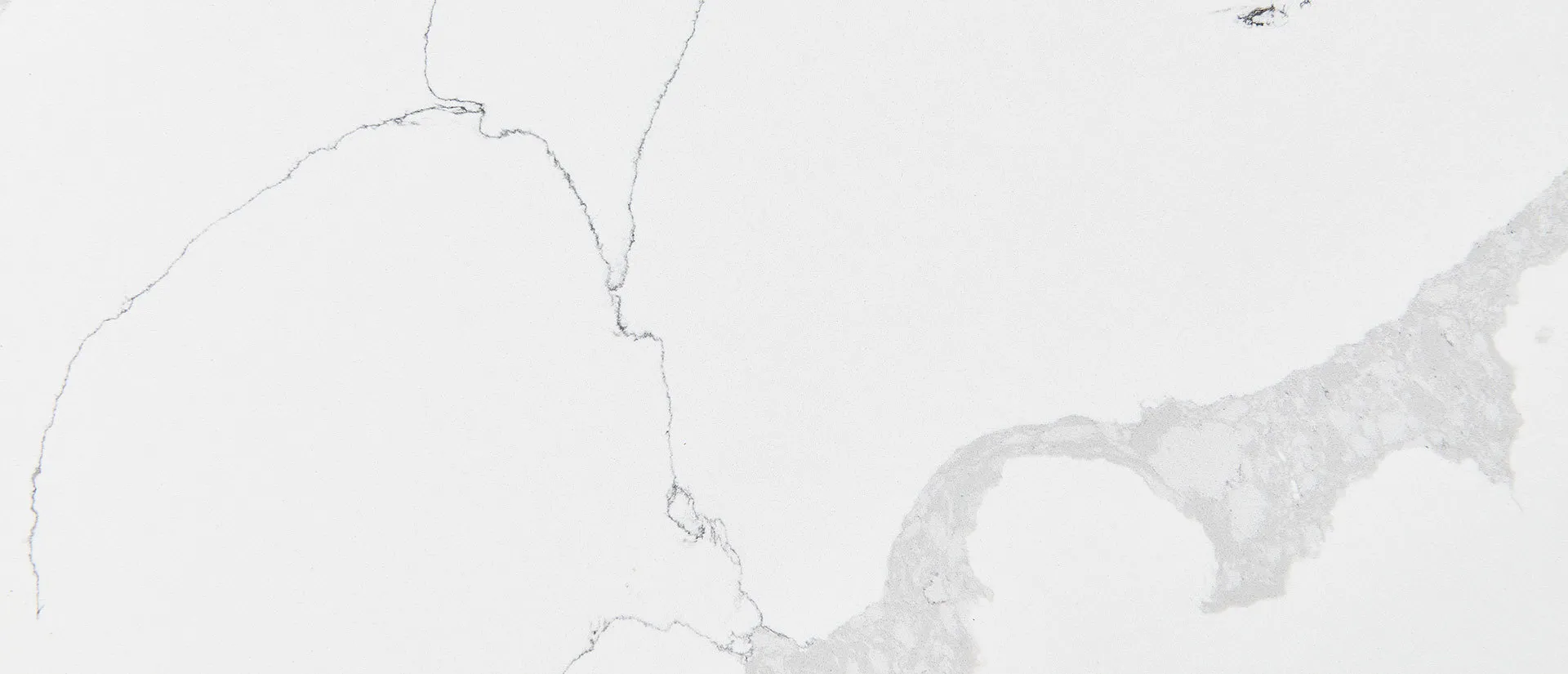 Closeup image of Q Quartz Calacatta Leon Quartz countertop slab