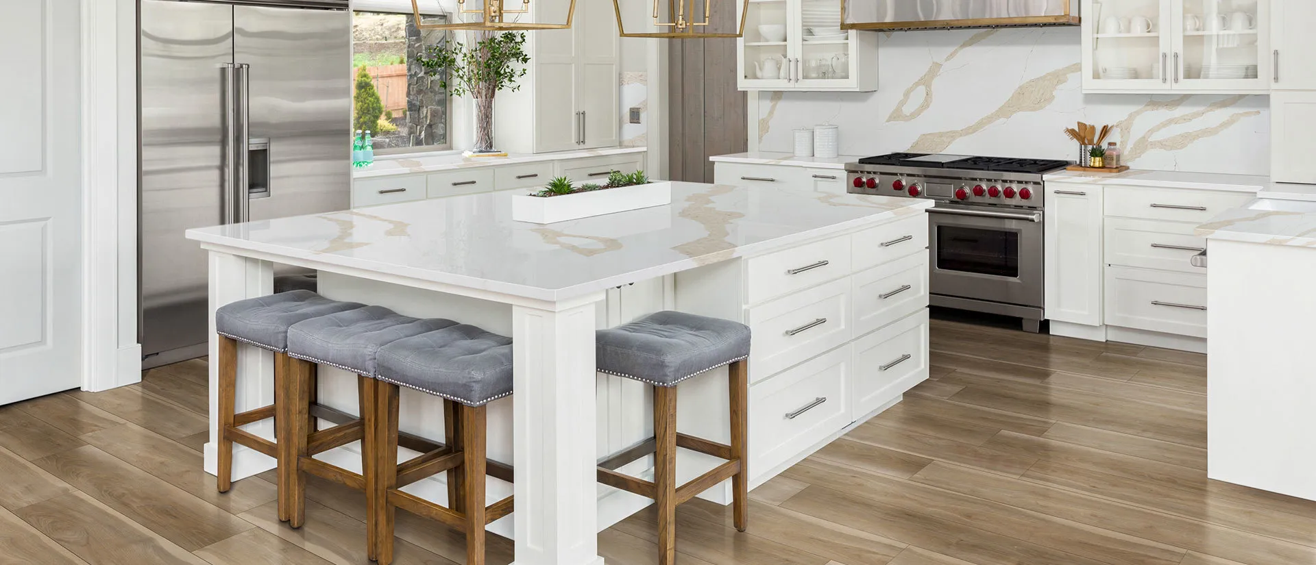 Image of installed Q Quartz Calacatta Leon Gold Quartz countertops