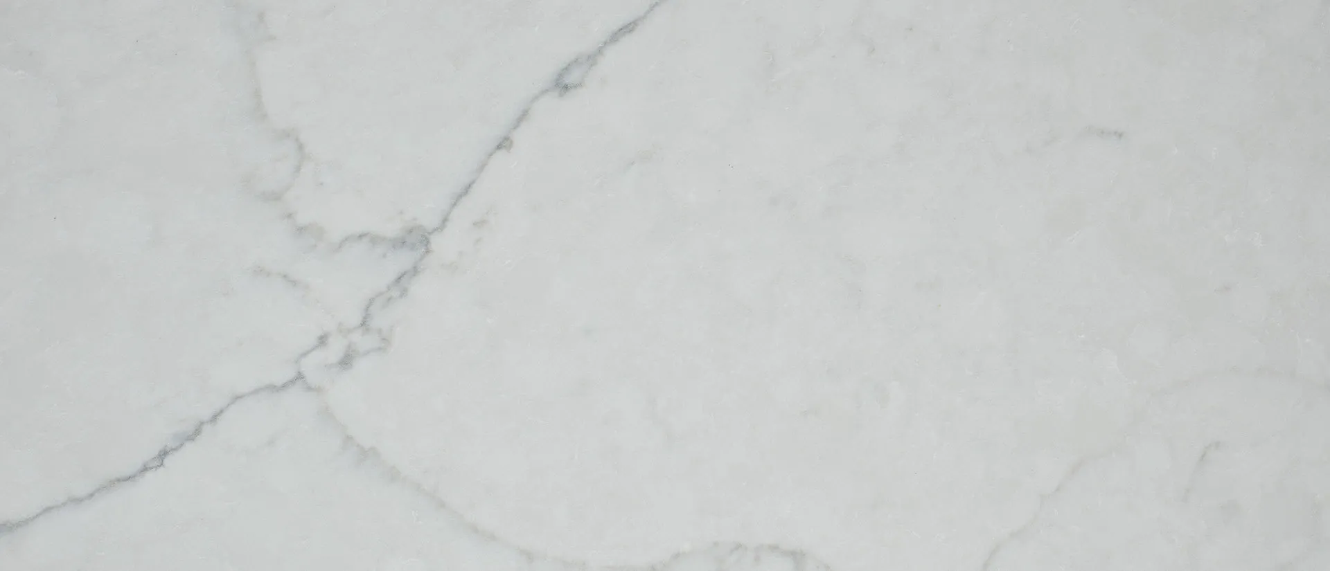 Closeup image of Q Quartz Calacatta Monaco White Quartz countertop slab