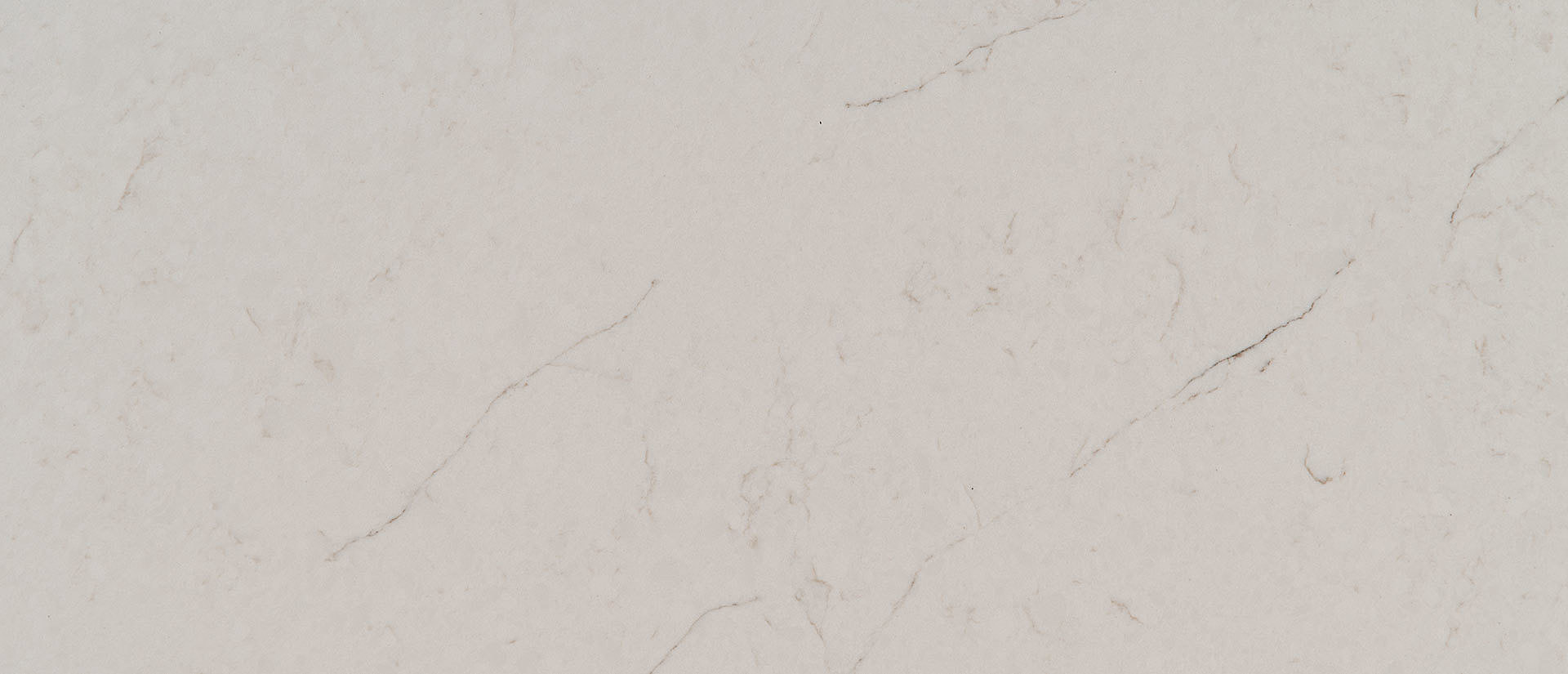 Closeup image of Q Quartz Carrara Caldia White Quartz countertop slab