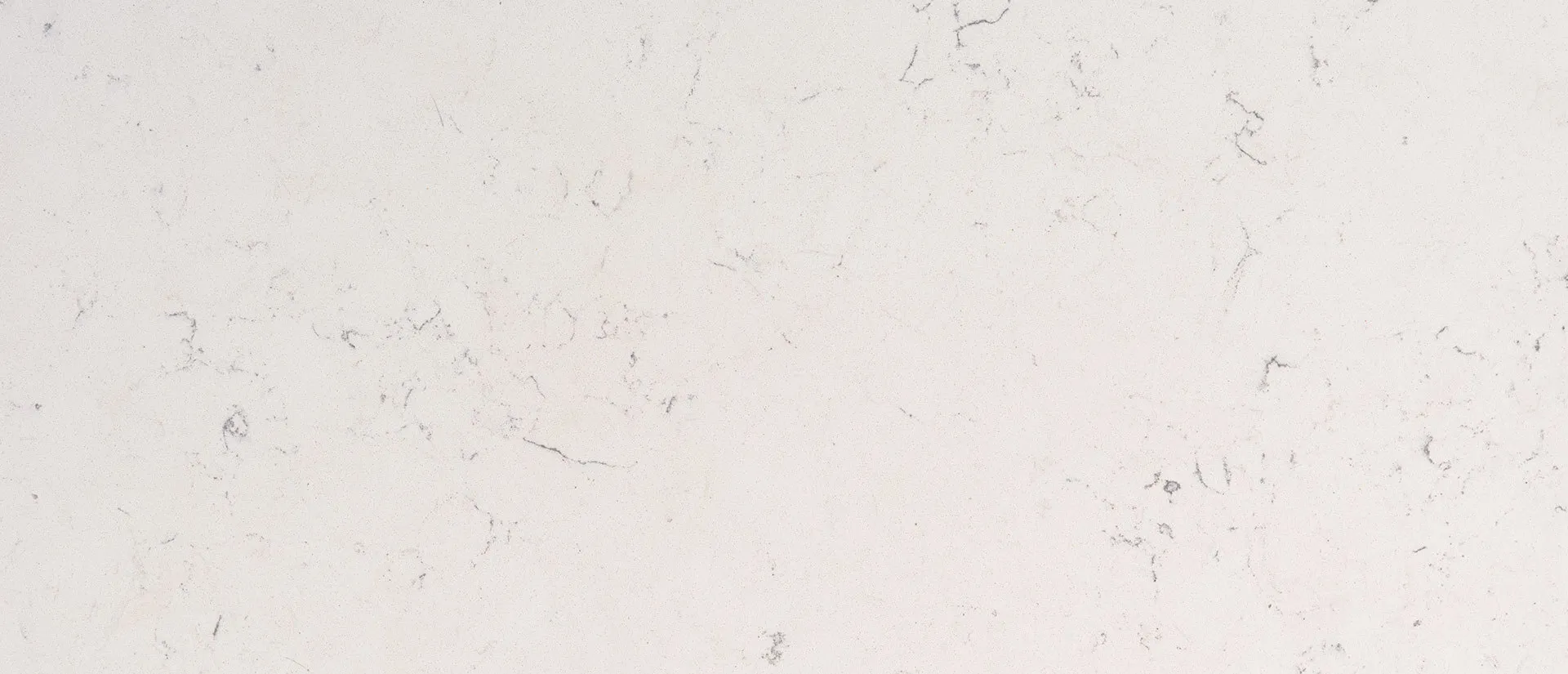 Closeup image of Q Quartz Carrara Marmi White Quartz countertop slab