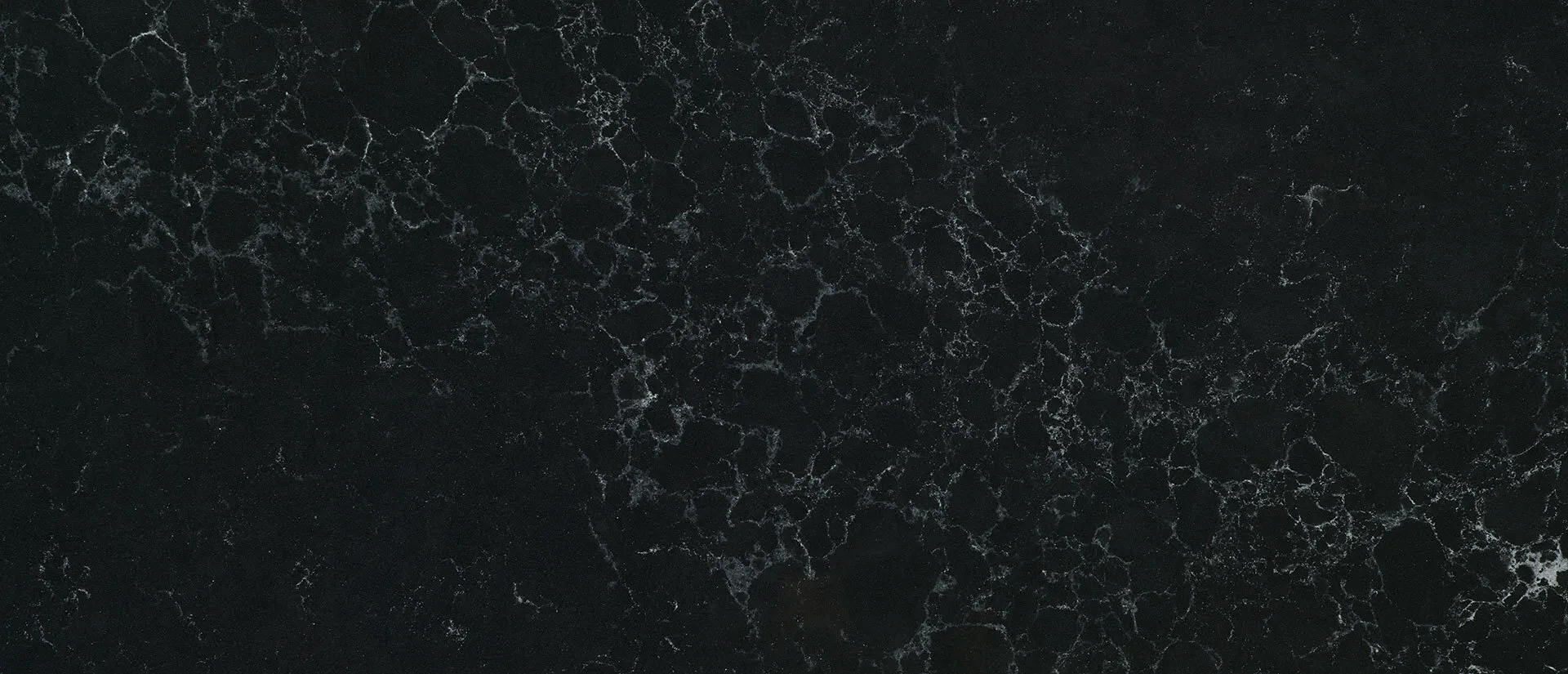 Closeup image of Q Quartz Midnight Corvo Quartz countertop slab