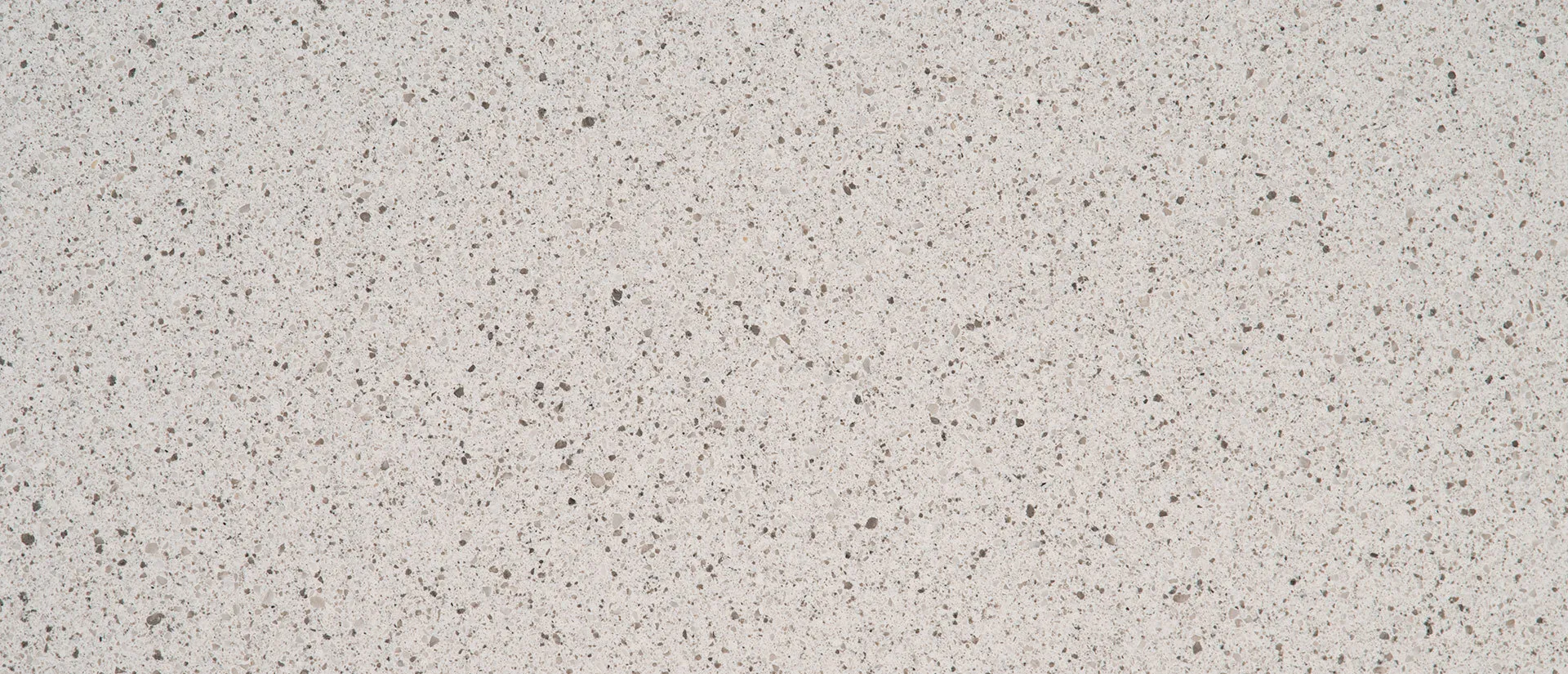 Closeup image of Q Quartz Peppercorn White Brown Quartz countertop slab