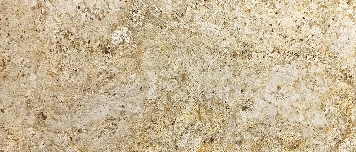 Closeup image of Colonial Cream Granite countertop slab