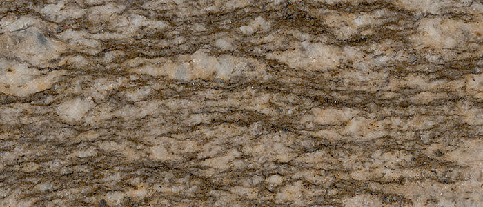 Closeup image of Savanna Gold Brown Granite countertop slab