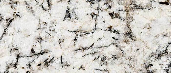 Closeup image of White Glimmer Grey Granite countertop slab