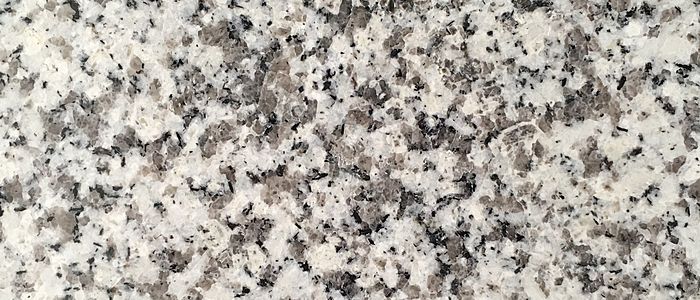 Closeup image of Bianco Diamante Cream Granite countertop slab