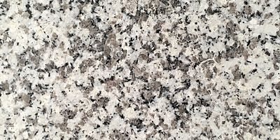 Closeup image of Bianco Diamante Cream Granite countertop slab