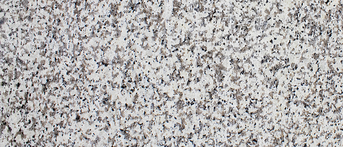 Closeup image of Blanco Real Grey Granite countertop slab