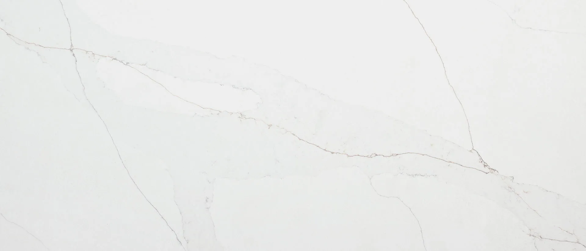 Closeup image of Q Quartz Calacatta Abezzo Quartz countertop slab