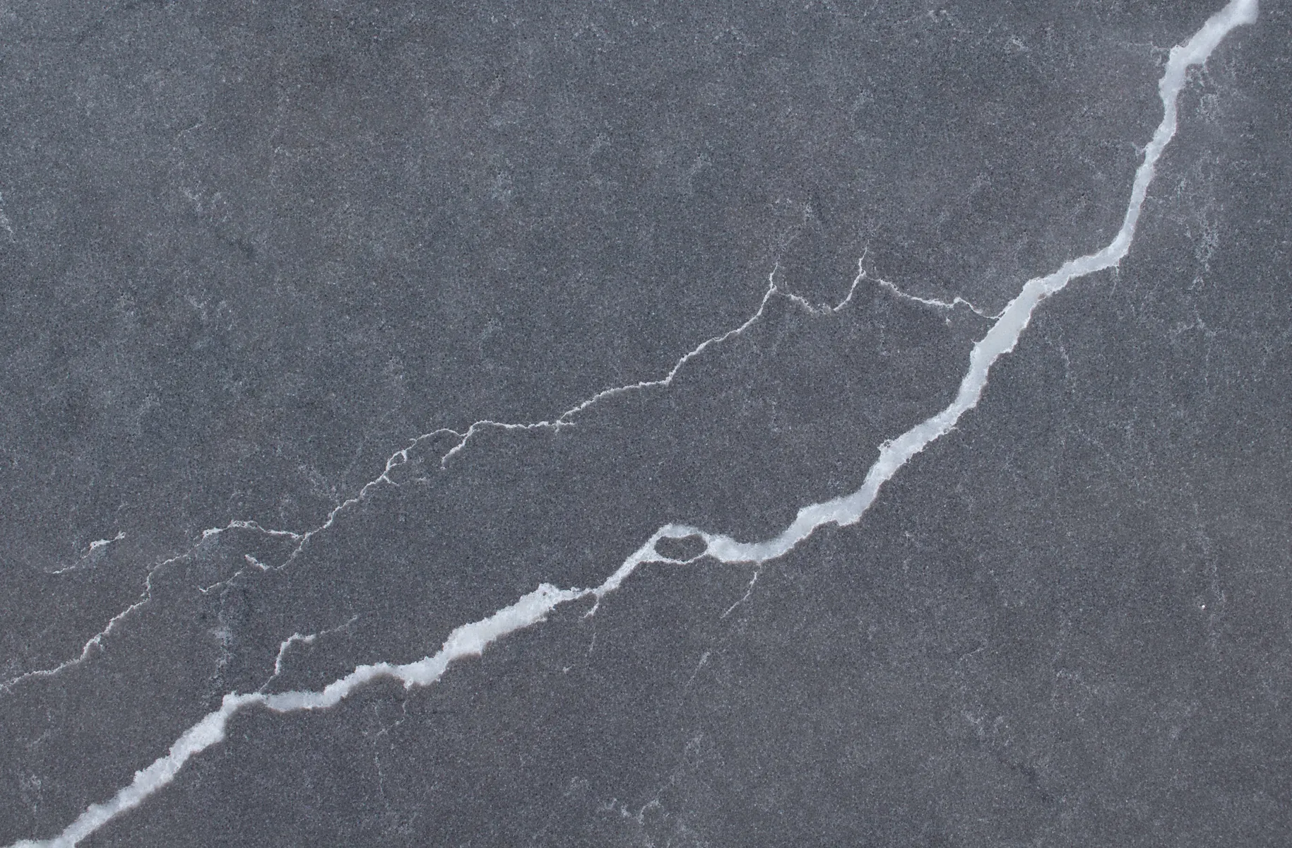 Closeup image of Vicostone Cemento Quartz countertop slab