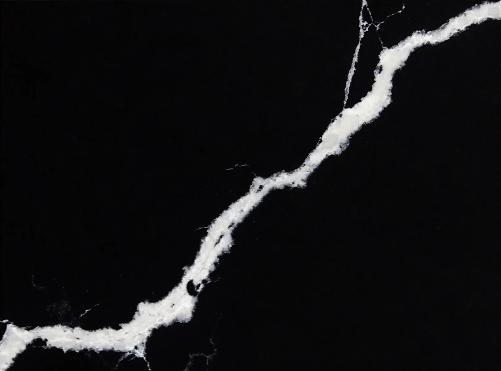 Closeup image of Vicostone Nero Marquina Quartz countertop slab