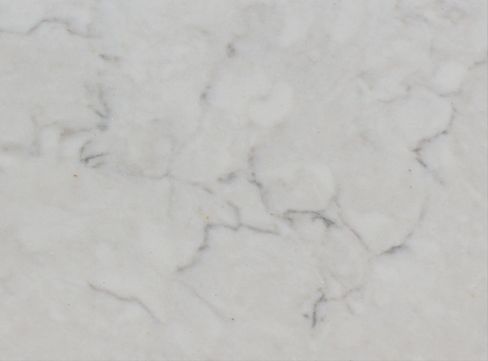 Closeup image of Vicostone Crema Chiffon Grey Quartz countertop slab