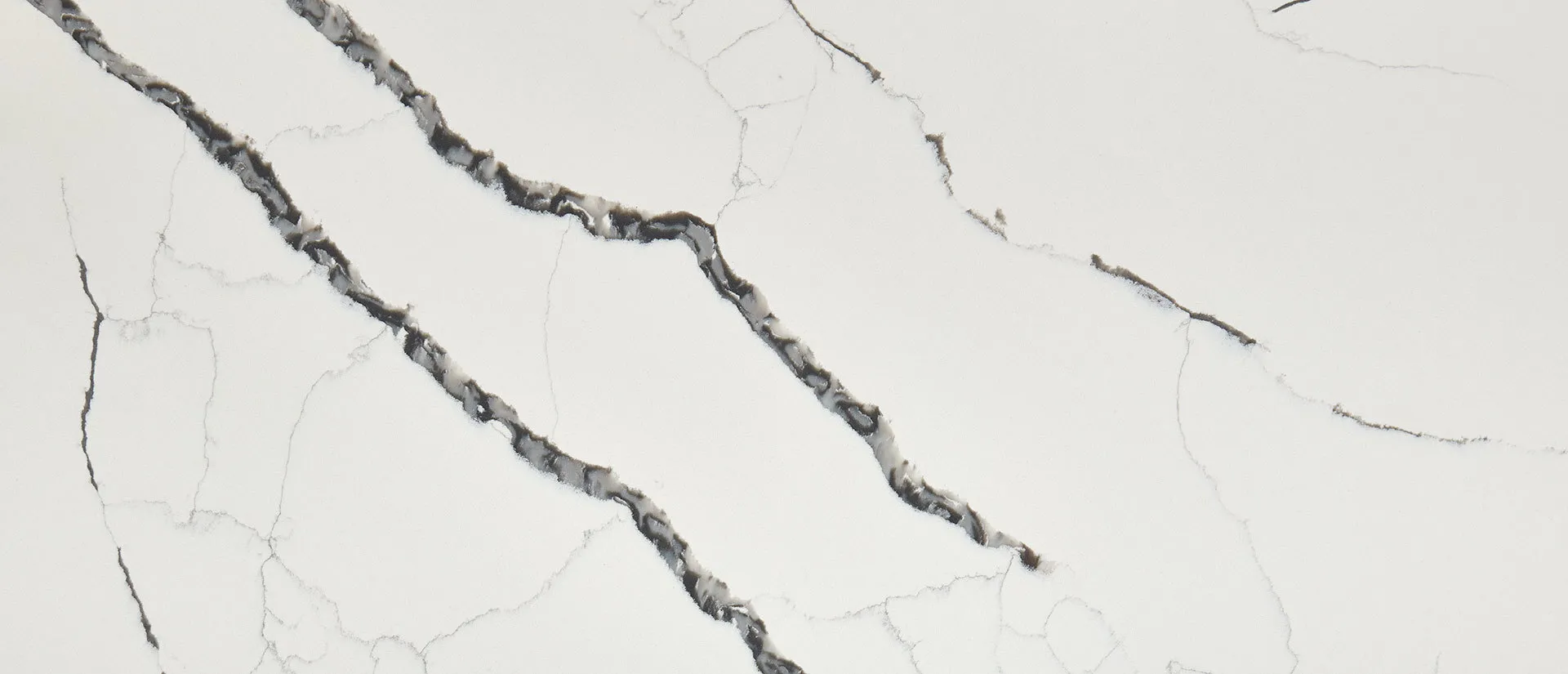 Closeup image of Q Quartz Calacatta Laza Night White Quartz countertop slab