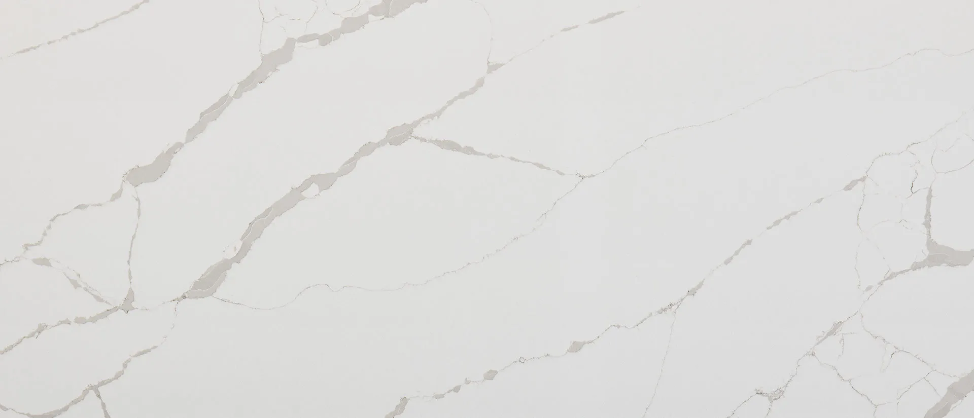 Closeup image of Q Quartz New Calacatta Laza White Quartz countertop slab