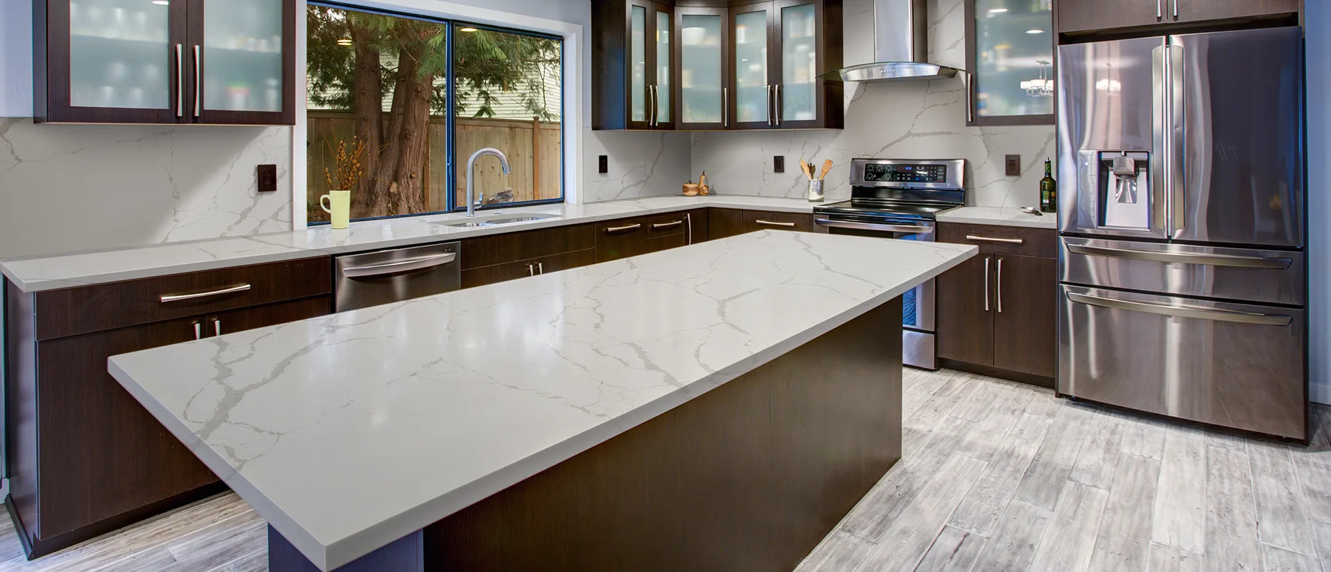 Image of installed Q Quartz New Calacatta Laza White Quartz countertops