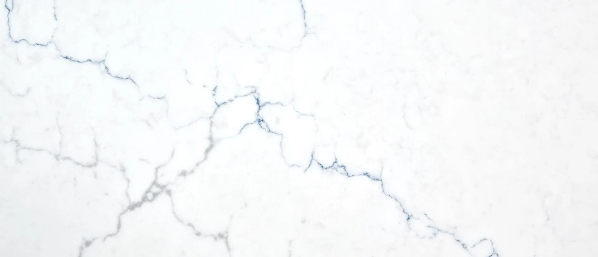 Closeup image of Q Quartz Calacatta Miraggio Cielo White Quartz countertop slab