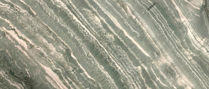 Closeup image of Vivid Green Grey Quartzite countertop slab