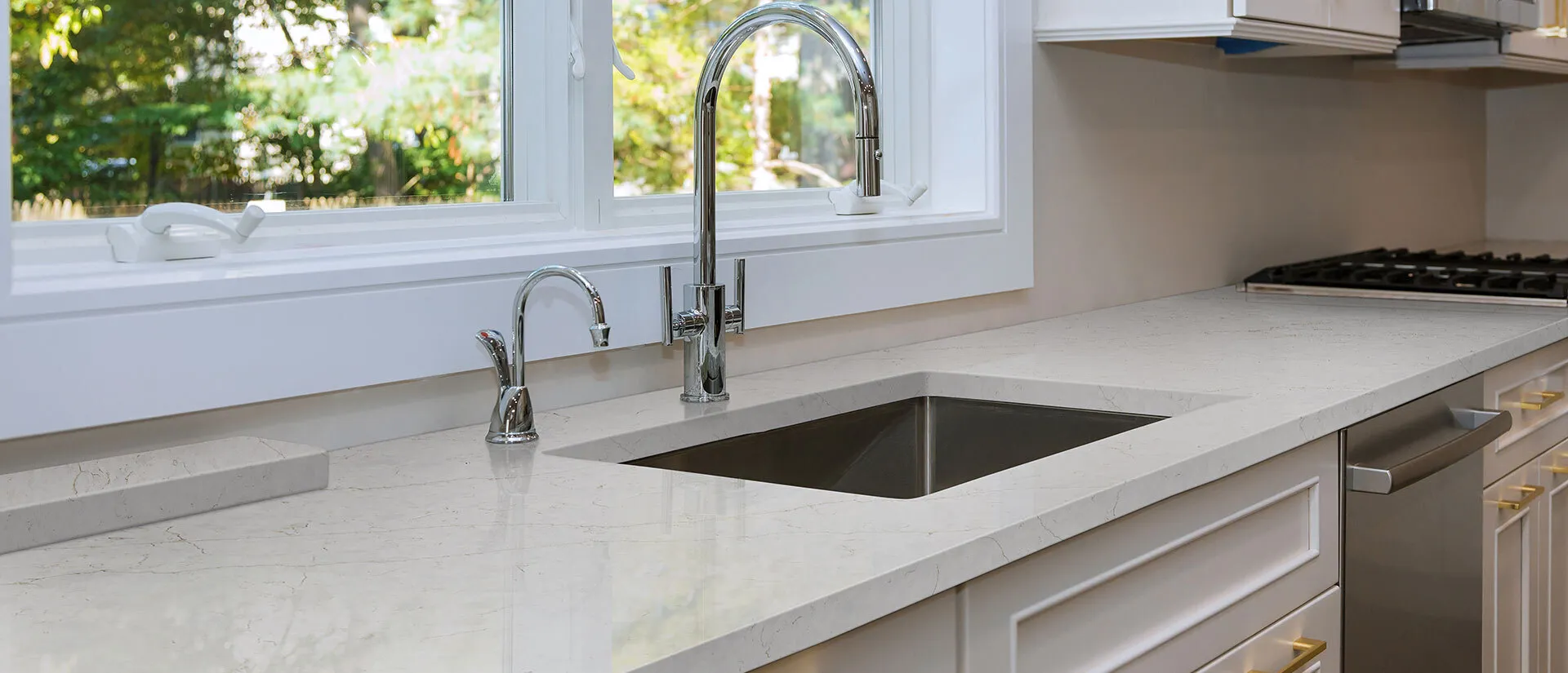 Image of installed Q Quartz Calacatta Karmelo Quartz countertops