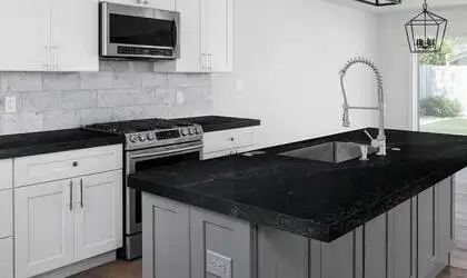 Image of installed Q Quartz Midnight Corvo Quartz countertops