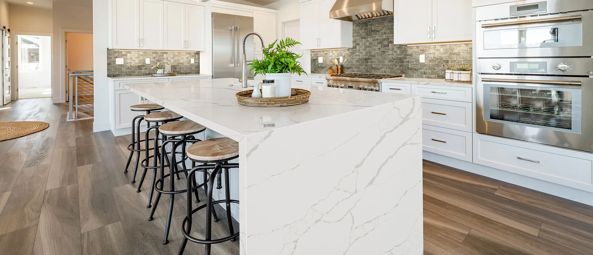 Image of installed Q Quartz New Calacatta Laza White Quartz countertops
