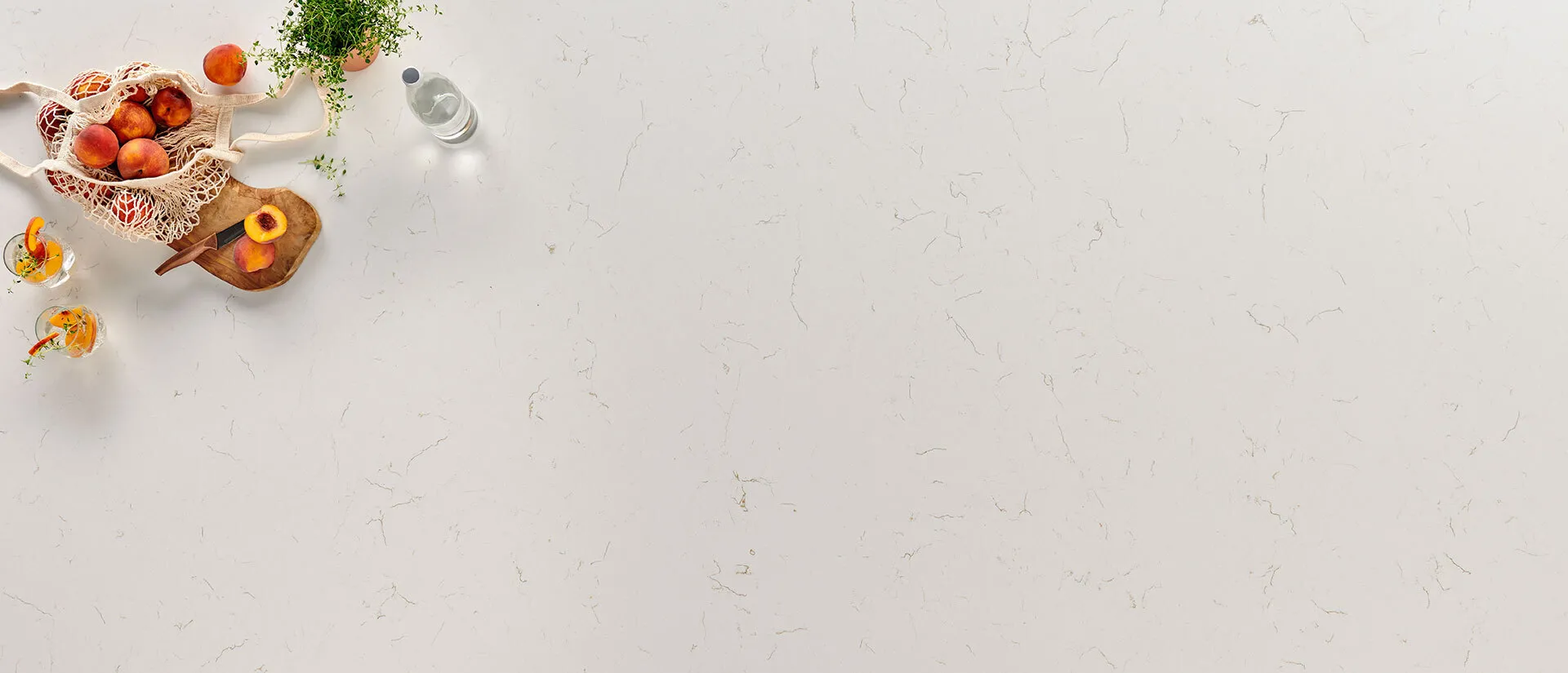 Image of installed Q Quartz Carrara Trigato White Quartz countertops