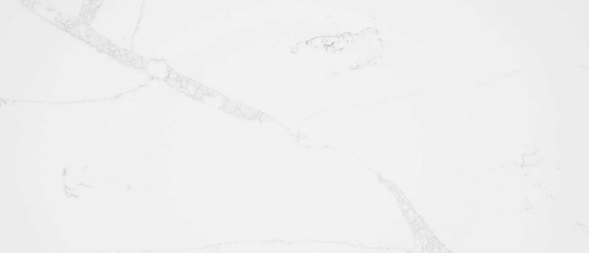 Closeup image of Q Quartz Calacatta Verona Quartz countertop slab