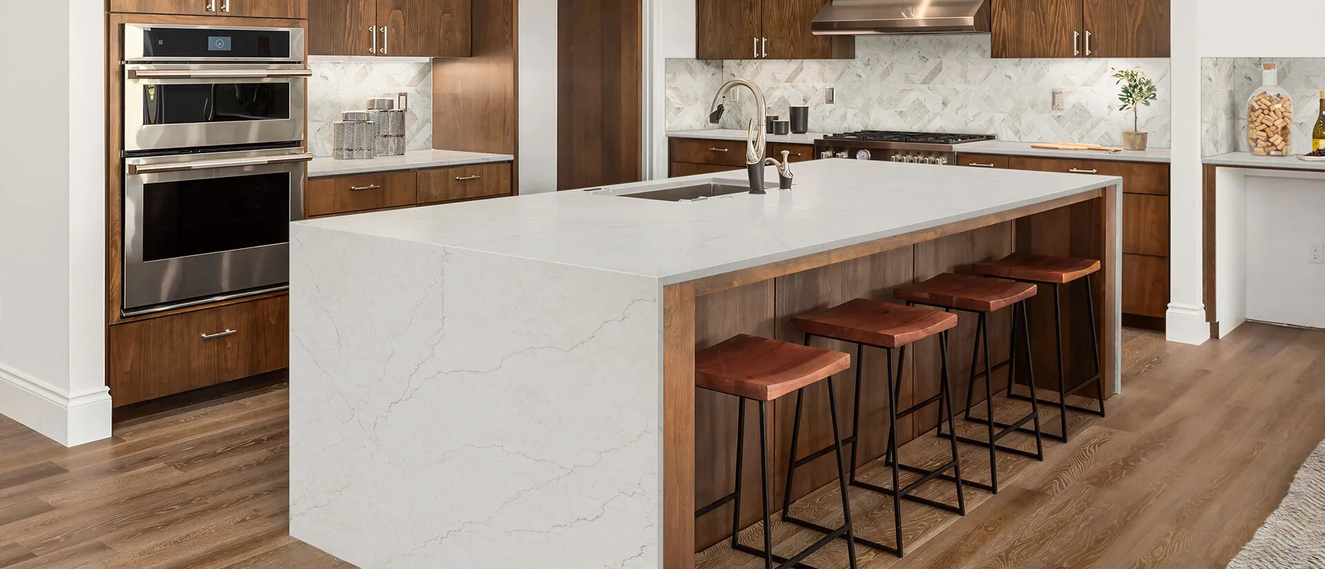 Image of installed Q Quartz Calacatta Miraggio Sienna White Quartz countertops