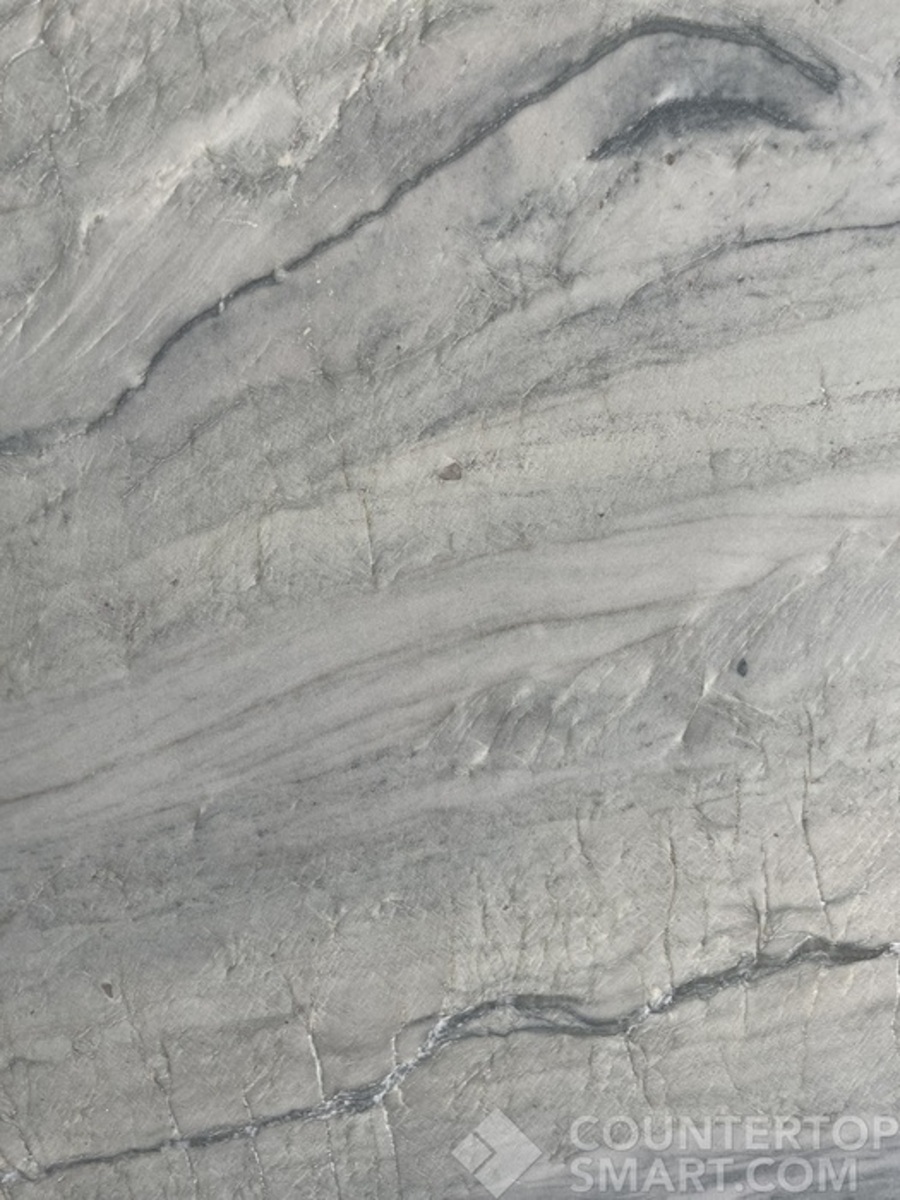 Closeup image of Ivory Macaubas White Quartzite countertop slab