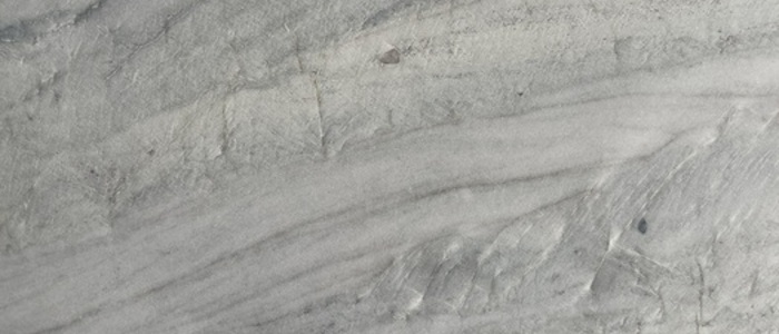 Closeup image of Ivory Macaubas White Quartzite countertop slab
