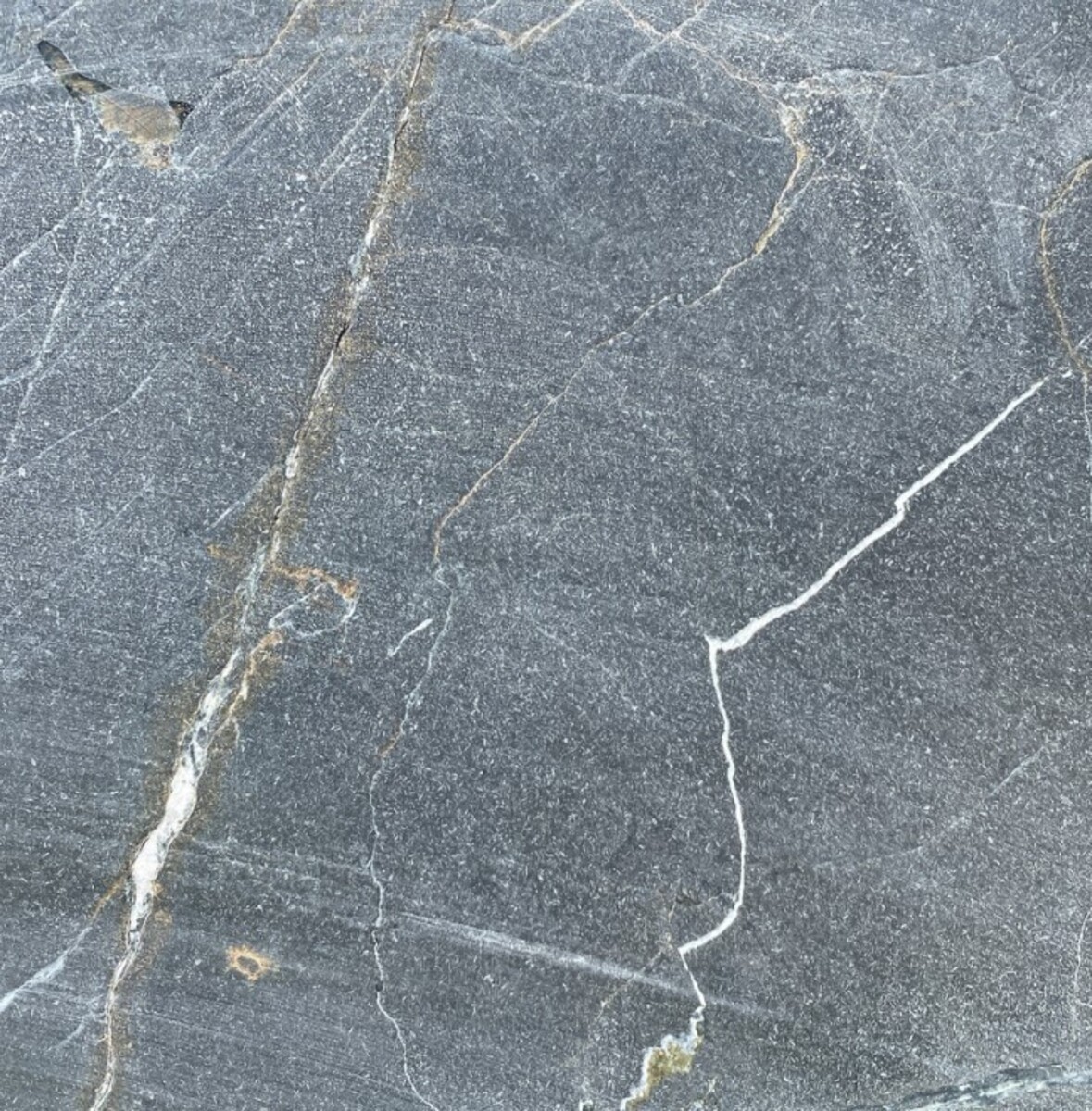 Closeup image of Infinity Leather Grey Granite countertop slab