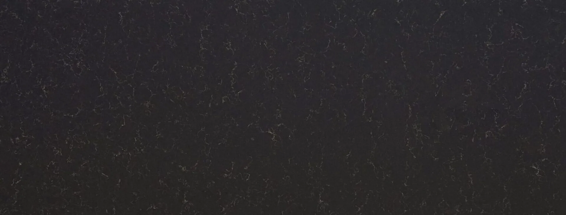 Closeup image of PentalQuartz Eclipse Black Quartz countertop slab