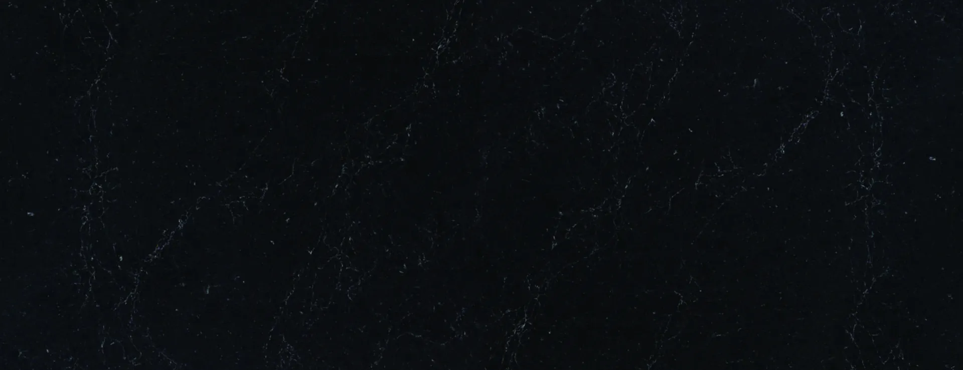 Closeup image of PentalQuartz Nightfall Black Quartz countertop slab