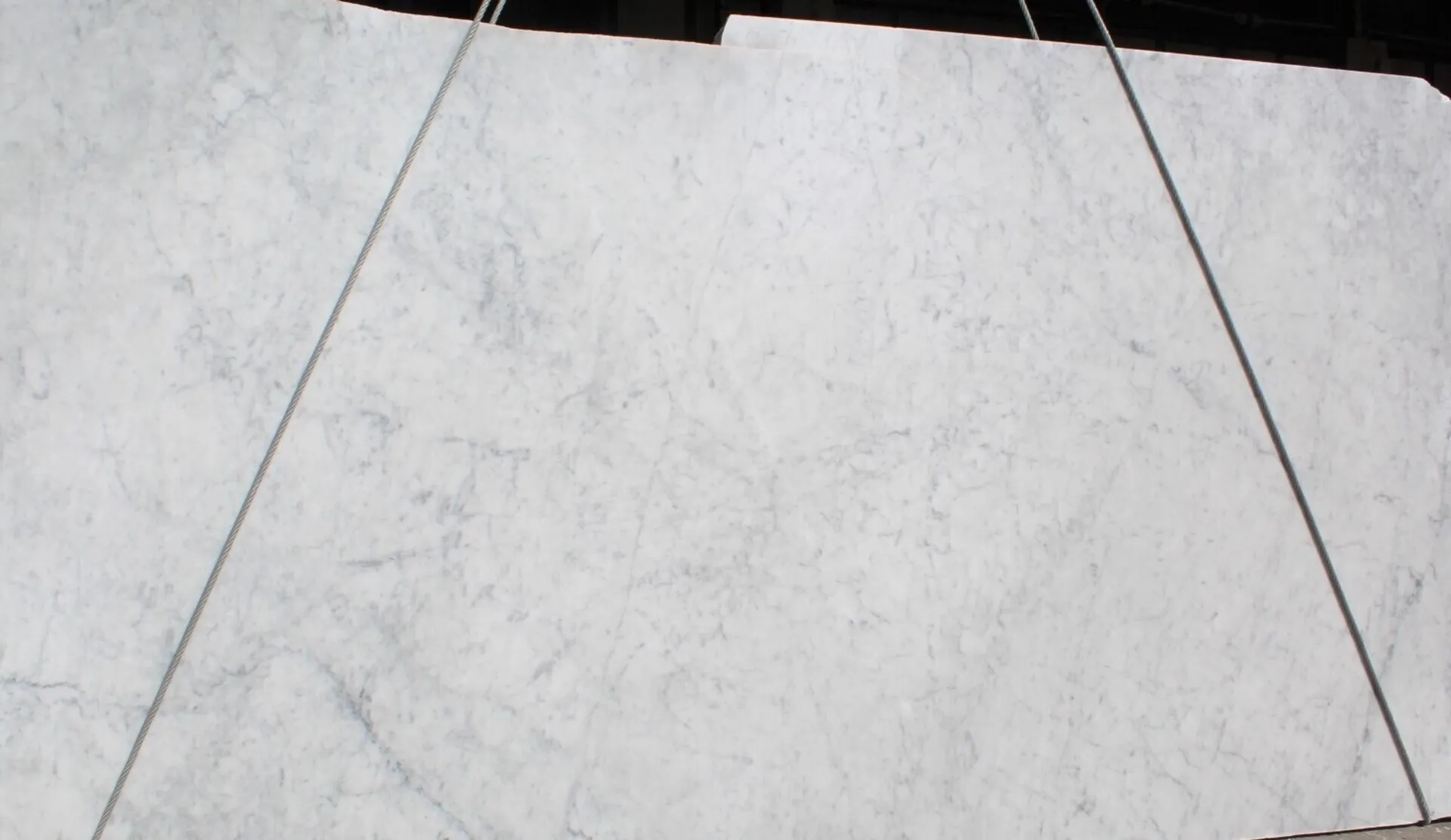Closeup image of Bianco Carrara White Marble countertop slab
